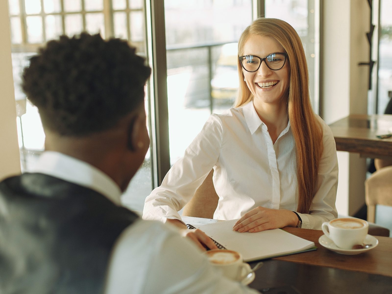 Advisor and founder talking across a table