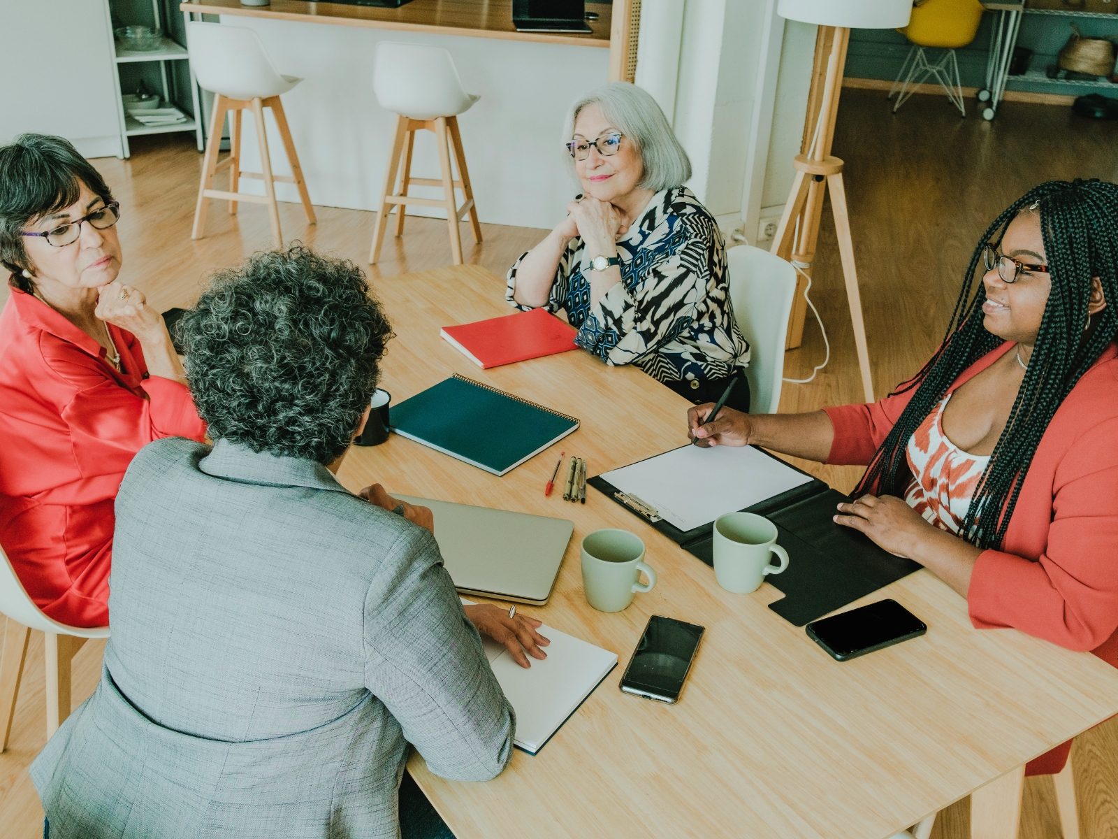 Team in discussion around a meeting table
